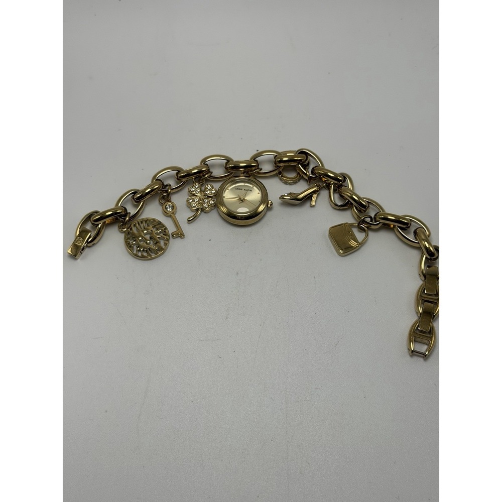 Anne Klein 10/7604GP New Battery Ladies Charm Watch 20MM‎ 7.5" Gold Tone
